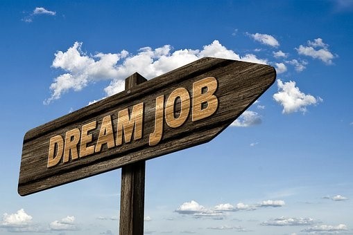 a sign that says "Dream Job"