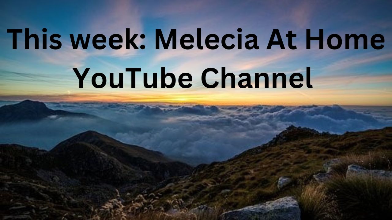 Have above mountain the black letters say "The where: Melecia At Home YouTube Channel"